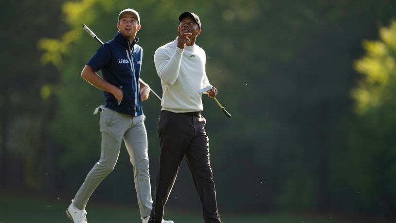 Will Zalatoris, left, and Tiger Woods walk to the12th green during a practice round in preparation for the Masters golf tournament at Augusta National Golf Club Monday, April 8, 2024, in Augusta, Ga. (AP Photo/George Walker IV)