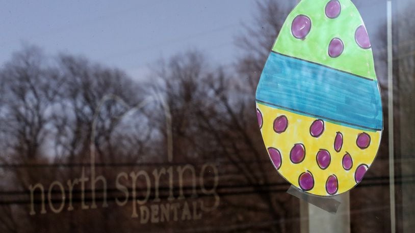 Some Springfield neighborhoods are participating in a social distancing egg hunt by putting Easter eggs in their windows. Bill Lackey/STAFF