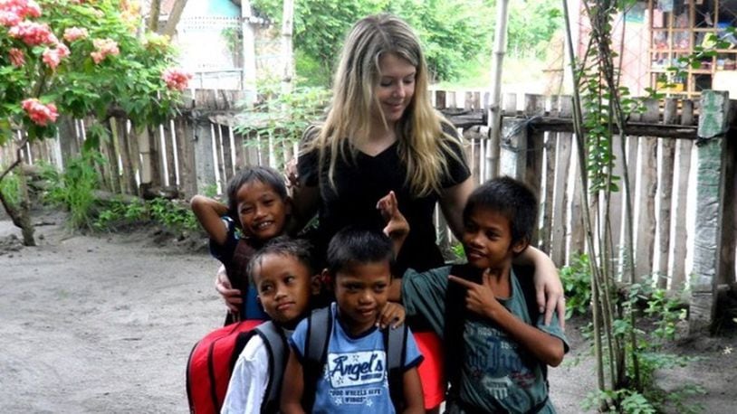 Meredith Wood poses with four of the fourteen children that currently live at her orphanage in General Santos City, Philippines. Contributed photo