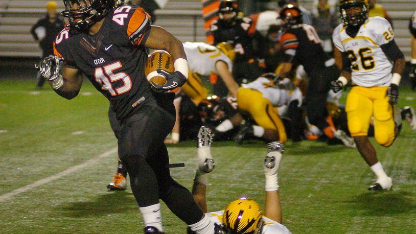 Beavercreek's linebacker Airius Moore rushes past Centerville's defense for the goal line at Frank Zink Field on Friday evening.