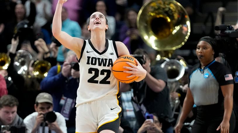 Iowa guard Caitlin Clark (22) celebrates after defeating LSU in an Elite Eight round college basketball game during the NCAA Tournament, Monday, April 1, 2024, in Albany, N.Y. (AP Photo/Mary Altaffer)