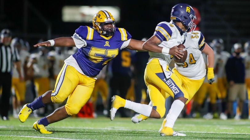 Cutline: Springfield High School's Jokell Brown brings down Toledo Whitmer quarterback Tommy Colbert during their Division I, Region 2 playoff game on Friday, Oct. 9. The Wildcats won 27-17. Brown is one of 24 seniors reurning for the Wildcats this fall. CONTRIBUTED PHOTO BY MICHAEL COOPER