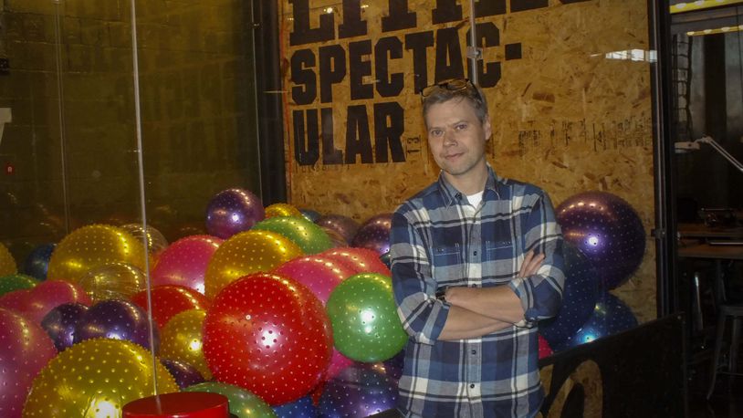 Founder and owner of the Proto BuildBar and Creator Director of Real Art standing next to the world’s largest Claw Game is Chris Wire. The claw game can be found and played at the Proto BuildBar.