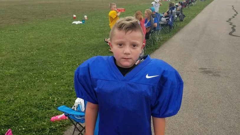 Barrett Fitzsimmons, 8, poses for a photo in his football uniform. Submitted photo