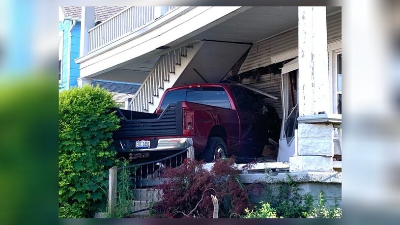 A pickup truck drove up a set of steps before slamming into a  duplex on North Isabella Street Wednesday evening, June 3, 2020, in Springfield. BILL LACKEY / STAFF