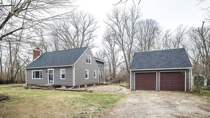 The 3-bedroom, Cape Cod-style home offers about 2,070 sq. ft. of living space and includes a new family/dining room addition and remodeled kitchen. The 1.25-acre lot with wooded views includes a detached, 2-car garage. CONTRIBUTED PHOTO