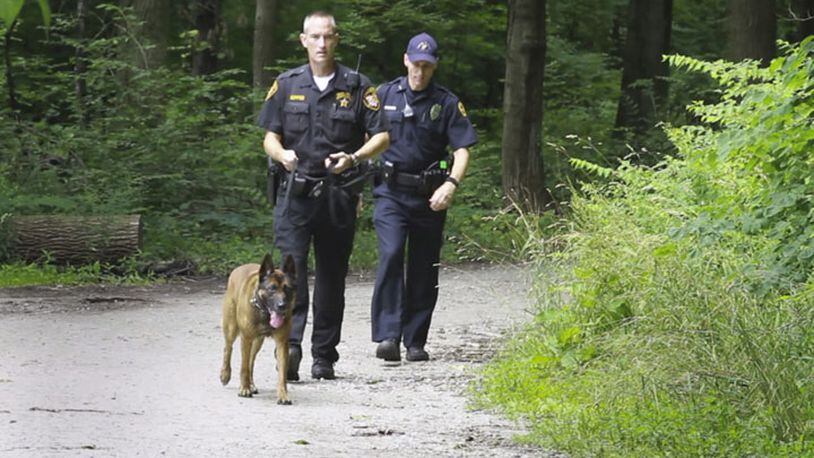 The Greene County Sheriff's office and other area law enforcement respond to the report of a man with a gun wearing camouflage at the Glen Helen Nature Preserve. The report at approximately 11:30 a.m. Thursday, prompted staff at Glen Helen's Outdoor Education Center to move children participating in summer Ecocamps to a secure location and staff at Antioch College locked down the campus at about 12:30 p.m. Greene County Sheriffâ€™s deputies and Yellow Springs Police officers are still searching for the man.