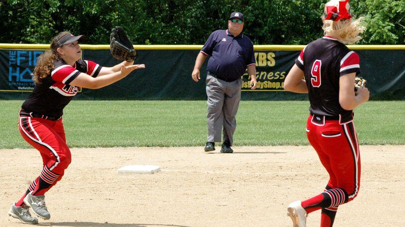 Lakota West shortstop Ariah Peregrina catches a popup in front of teammate Alyssa Triner  during a Division I regional championship softball game against Lakota East at Centerville in 2019. FILE PHOTO
