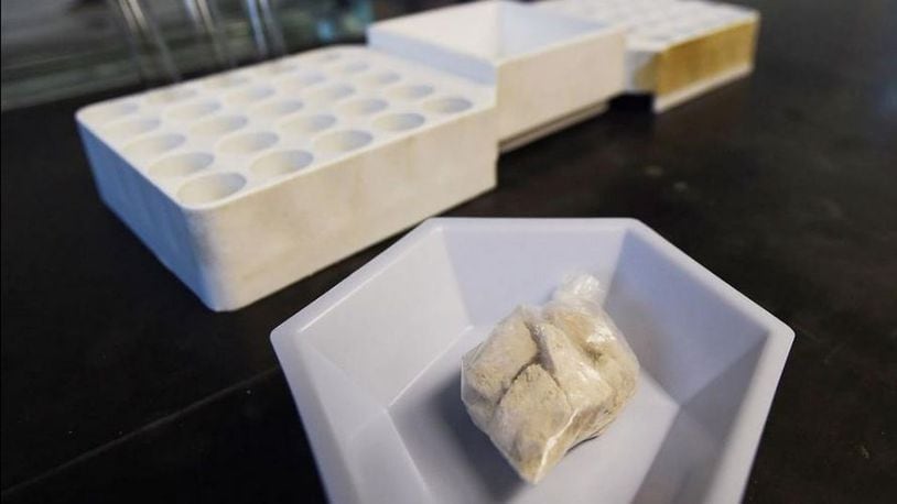The drug “gray death” lies in a dish at the crime lab of the Georgia Bureau of Investigations. Investigators who nicknamed the mixture have detected it, or recorded overdoses blamed on it, in Ohio, Alabama and Georgia. (AP Photo/Mike Stewart)