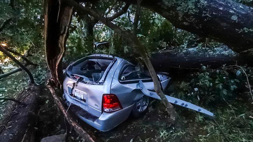 A vehicle is smashed under a fallen tree when Hurricane Michael whipped through Georgia on Wednesday. One person was killed by metal debris. She was identified as 11-year-old Sarah Radney, who was killed in Seminole County, Georgia, while staying with her grandparents.