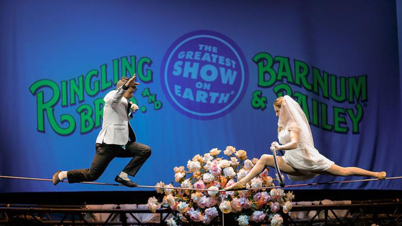 HOUSTON, TX - JULY 26:  XTREME High Wire Walkers, Mustafa Danguir and Anna Lebedeva, of Ringling Bros. and Barnum & Bailey exchange wedding vows 30 feet above the NRG Stadium floor on a high wire that is no wider than a human thumb at NRG Park on July 26, 2016 in Houston, Texas.  (Photo by Bob Levey/Getty Images for Feld Entertainment)
