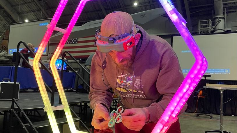 Kele Stanley, micro-drone race organizer, examines his drone, which weighs just 20 grams, before taking a practice run ahead of last year's race event at the National Museum of the U.S. Air Force.
