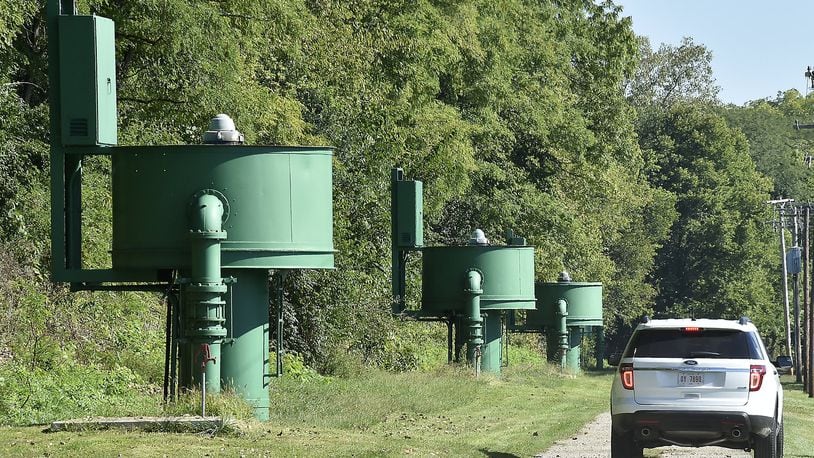 A city of Springfield employee drives past the row of pumps in the city’s fresh water well field along Eagle City Road in 2014.Bill Lackey/Staff