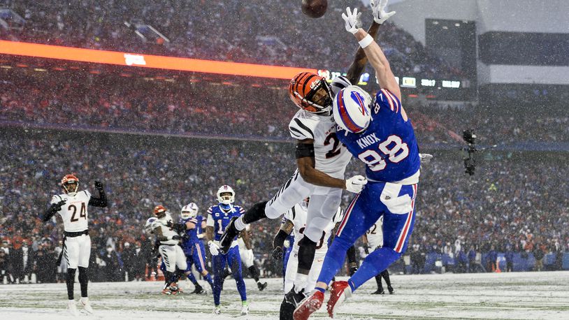 Cincinnati Bengals safety Dax Hill (23) breaks up a pass intended for Buffalo Bills tight end Dawson Knox (88) during the third quarter of an NFL division round football game, Sunday, Jan. 22, 2023, in Orchard Park, N.Y. (AP Photo/Adrian Kraus)