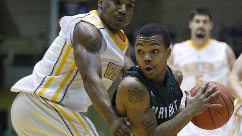 Wright State’s Reggie Arceneaux is guarded by Valparaiso’s LaVonte Dorrity on Tuesday, March 12, 2013, at Valparaiso in the Horizon League championship game. David Jablonski/Staff