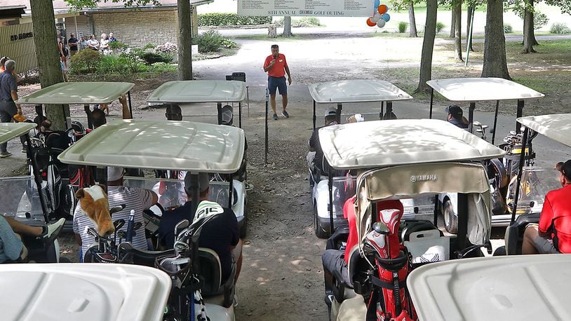 Dozens of golfers wait in their carts for the beginning of the 8th annual KB&P Financial Partners Charity Invitational golf outing at Reid Park Golf Course in Clark County Friday, Sept. 16, 2022. The annual event has raised over $100,000 for local charities. BILL LACKEY/STAFF