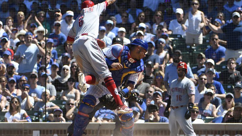 CHICAGO, IL - JULY 08: Billy Hamilton #6 of the Cincinnati Reds is safe at home as Willson Contreras #40 of the Chicago Cubs can’t handle the throw during the fifth inning on July 8, 2018 at Wrigley Field in Chicago, Illinois. (Photo by David Banks/Getty Images)