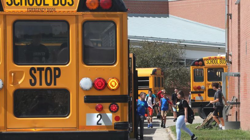 Students board buses at Clark-Shawnee schools. File art.