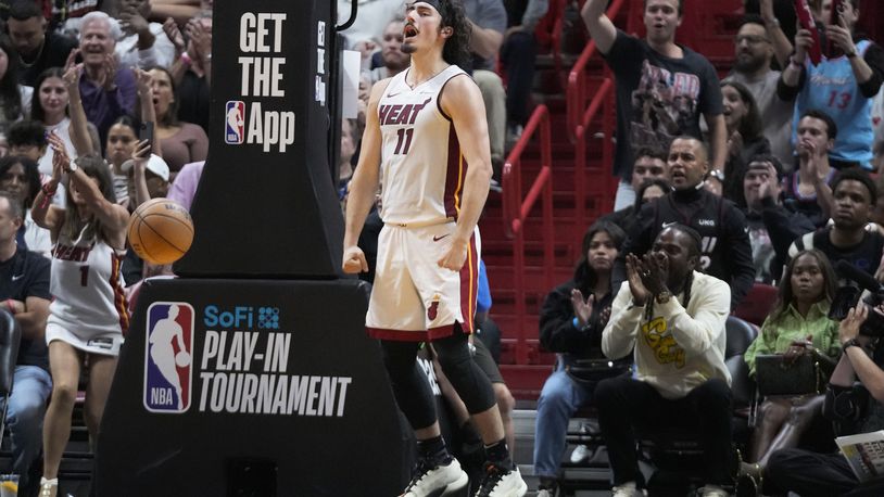 Miami Heat forward Jaime Jaquez Jr. celebrates after a play during the second half of an NBA basketball play-in tournament game against the Chicago Bulls, Friday, April 19, 2024, in Miami. (AP Photo/Wilfredo Lee)