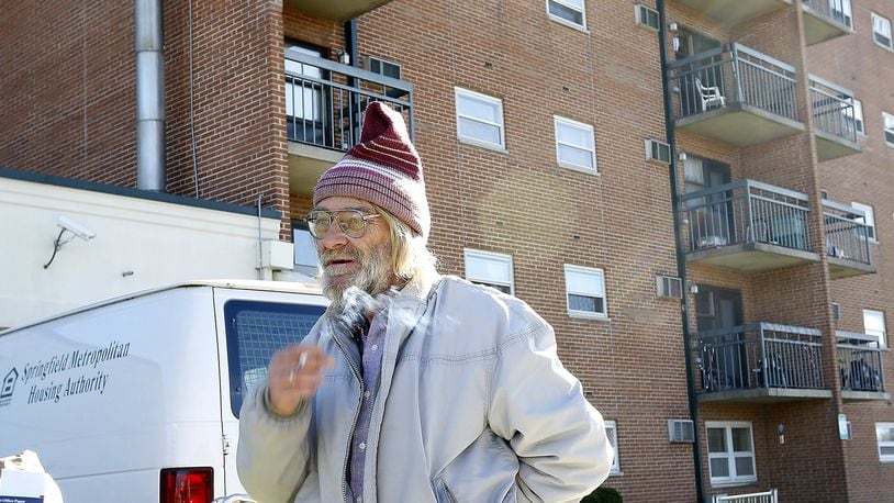 David Kohler, a resident a Hugh Taylor Apartments, smokes a cigarette as he talks about the proposed ban on smoking in public housing in November of 2015. Bill Lackey/Staff