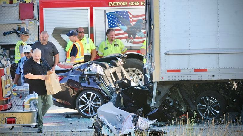 Two people died after a Chevrolet Malibu crashed into the back of a semi-truck on U.S. 35 east in Jamestown near state Route 72 Friday, July 15, 2022. MARSHALL GORBY / STAFF