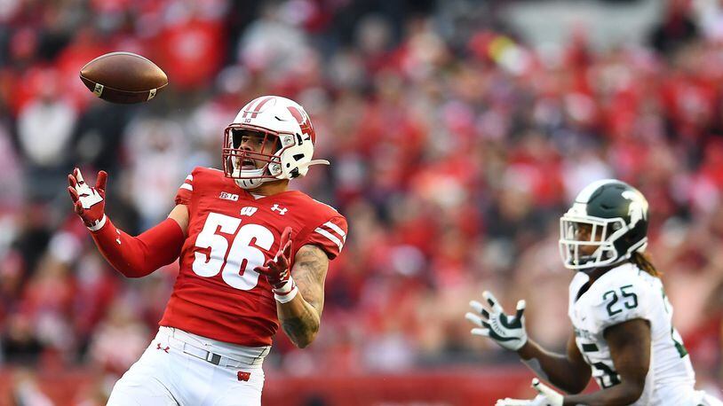 MADISON, WISCONSIN - OCTOBER 12: Zack Baun #56 of the Wisconsin Badgers intercepts a pass intended for Darrell Stewart Jr. #25 of the Michigan State Spartans during the second half of a game at Camp Randall Stadium on October 12, 2019 in Madison, Wisconsin. (Photo by Stacy Revere/Getty Images)