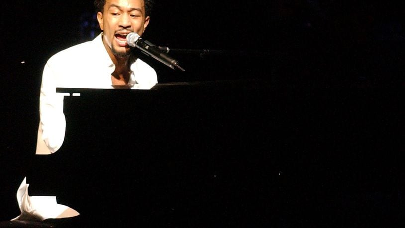 John Legend performs on the opening night of the Veterans Park Amphitheater in Springfield on Tuesday, July 26, 2005. FILE