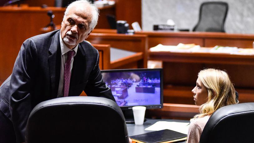 Brooke “Skylar” Richardson, right, talks to attorney Charles H. Rittgers in the courtroom before closing arguments in her trial at Warren County Common Pleas Court Thursday, September 12, 2019. The 20-year-old is accused of killing and burying her baby in the backyard of her Carlisle home. Richardson was charged with aggravated murder, involuntary manslaughter, gross abuse of a corpse, tampering with evidence and child endangerment in the death of her newborn infant. The judge dismissed the tampering with evidence charge Monday after arguments from both sides. She faces the possibility of life in prison. NICK GRAHAM/JOURNAL-NEWS/POOL