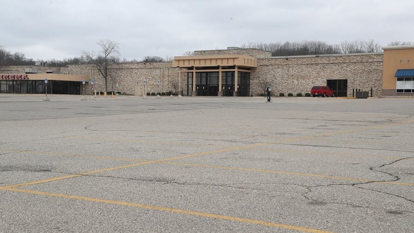 The parking lot of the Upper Valley Mall was empty Tuesday after it closed due to the stay-at-home order. BILL LACKEY/STAFF