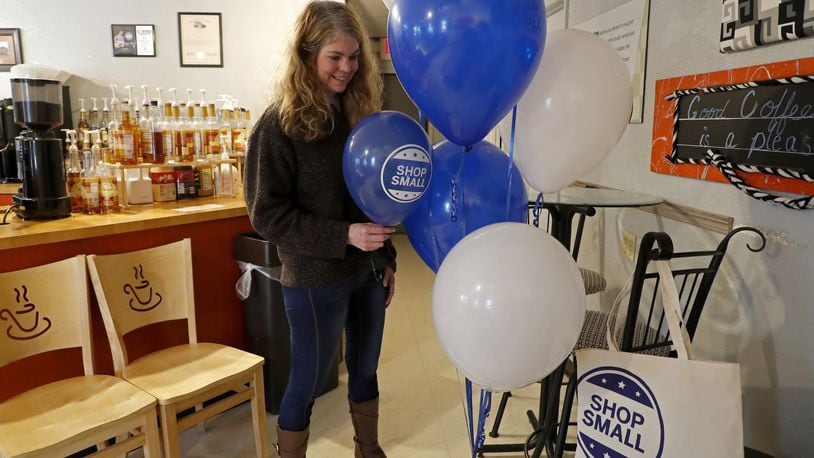 Jacque Evrard, owner of Springfield Balloons LTD, drops off some balloons at Coffee Expressions for Small Business Saturday. Bill Lackey/Staff