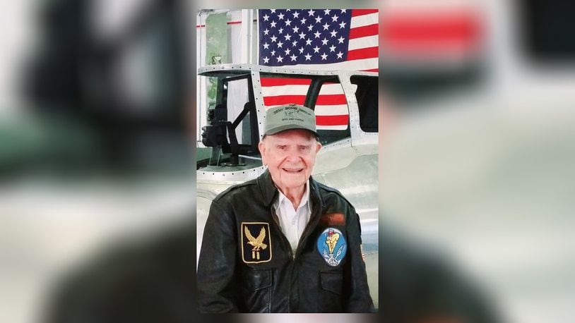 World War II veteran Art Kemp standing in front of his tailgunner position, wearing a 351st Bomb Group hat, and a leather A2 flight jacket with the symbols of the 351st Bomb Group and also his bomb squadron. Contributed/Greg Schafer