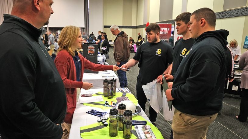 Chad Campbell and Becca McGillis, from Marker, talks with a group of seniors from Shawnee High School Thursday, April 21, 2022 during the annual Clark County Job Fair in the Hollenbeck-Bayley Conference Center 