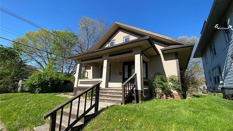 The 2-story’s front has a concrete walk leading to wood steps and a covered concrete porch. The 3-bedroom home offers about 1,460 sq. ft. of living space and includes a full, unfinished basement. CONTRIBUTED PHOTO