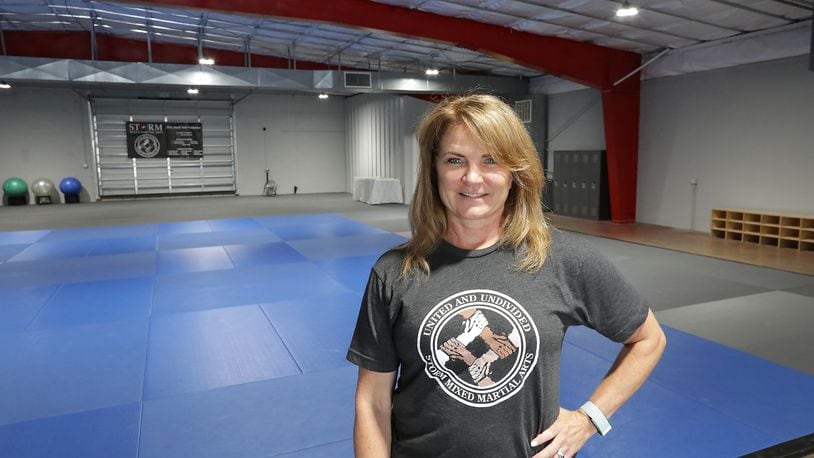 Sandy Bise, owner of Storm Mixed Martial Arts, in their new training center on North Thompson Avenue Thursday. BILL LACKEY/STAFF