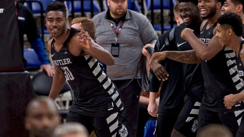 Butler forward Kelan Martin, left, reacts after making the game winning basket during overtime of an NCAA college basketball game against Ohio State in the Phil Knight Invitational tournament in Portland, Ore., Sunday, Nov. 26, 2017. (AP Photo/Craig Mitchelldyer)