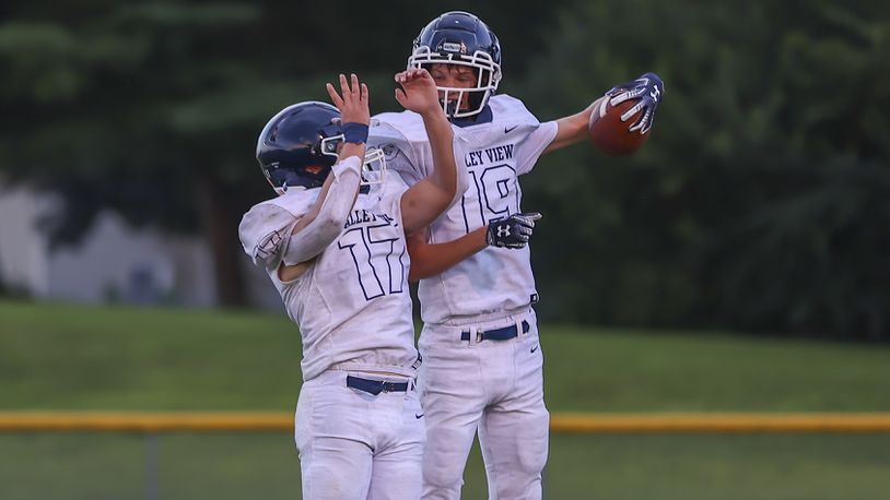 Cutline 3: Valley View High School junior Troy Hypes (right) celebrates with junior Cade Sears after scoring a touchdown during their game against Shawnee on Friday night in Springfield. The Spartans won 25-7. CONTRIBUTED PHOTO BY MICHAEL COOPER