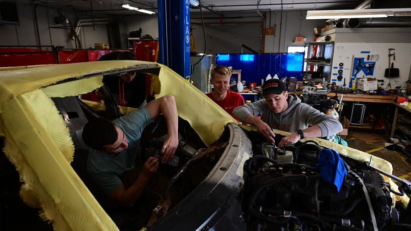 Will Hanak, John Thomson, and Tim Junker are in Cedarville's engineering lab to work on the refurbished Mercedes. | CONTRIBUTED