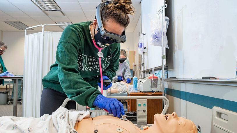 Wright State University nursing students use augmented reality to better assess patients, with virtual hearts, lungs and other internal body parts coming to life to enhance the learning experience. Contributed photo/Wright State University