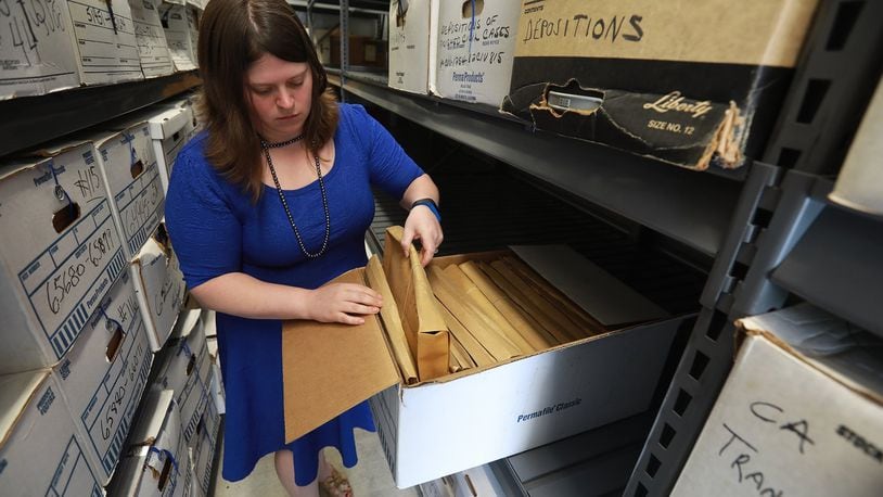 Melissa Tuttle, Clark County Clerk of Courts, looks through a records box in the newly organized off site storage unit at Springview Government Center. BILL LACKEY/STAFF