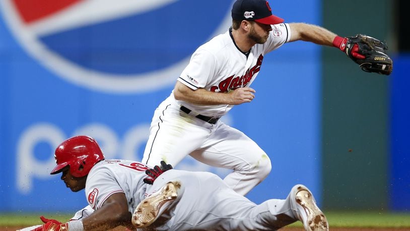 CLEVELAND, OH - JUNE 11: Yasiel Puig #66 of the Cincinnati Reds is safe at second base with a double as Mike Freeman #6 of the Cleveland Indians covers during the seventh inning at Progressive Field on June 11, 2019 in Cleveland, Ohio. (Photo by Ron Schwane/Getty Images)