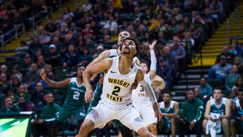 Wright State’s Tanner Holden blocks out a Green Bay defender at the Nutter Center on Dec. 28, 2019. Joseph Craven/WSU Athletics