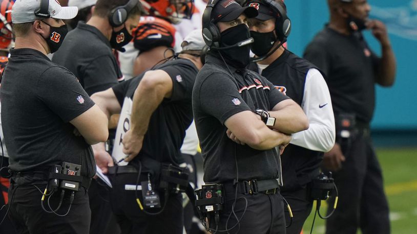 Cincinnati Bengals head coach Zac Taylor watched his team during the second half of an NFL football game against the Miami Dolphins, Sunday, Dec. 6, 2020, in Miami Gardens, Fla. (AP Photo/Lynne Sladky)