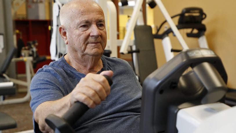Richard Mitchell works out in the fitness room at United Senior Services in Springfield for an hour a day and has lost 40 pounds in the past year. Bill Lackey/Staff