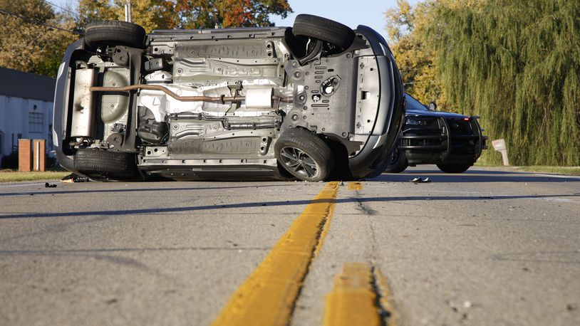 All four passengers escaped a two car crash at the intersection of U.S. 40 (West National Road) and North Tecumseh Road on Tuesday morning Oct. 24, 2023. BILL LACKEY/STAFF