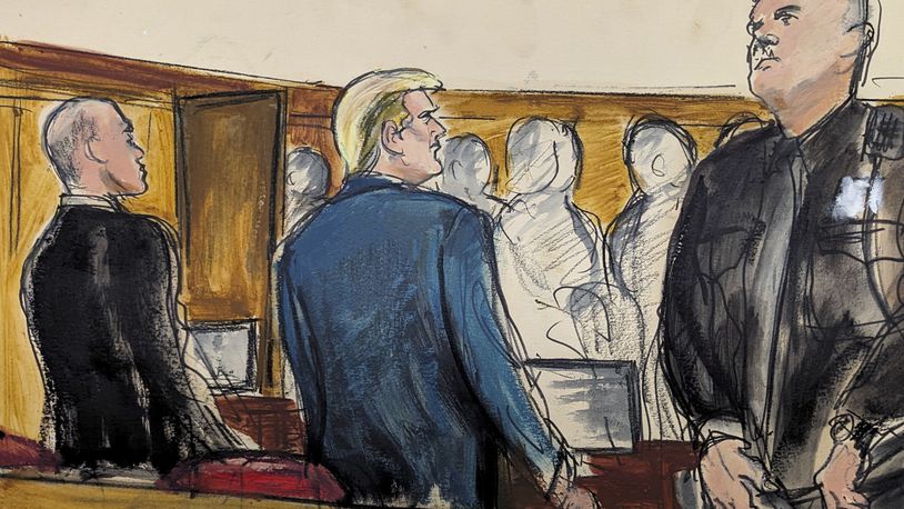 Donald Trump stands as the jury files into the courtroom at the start of the trial in Manhattan criminal court Monday, April 22, 2024, in New York. (Elizabeth Williams via AP)