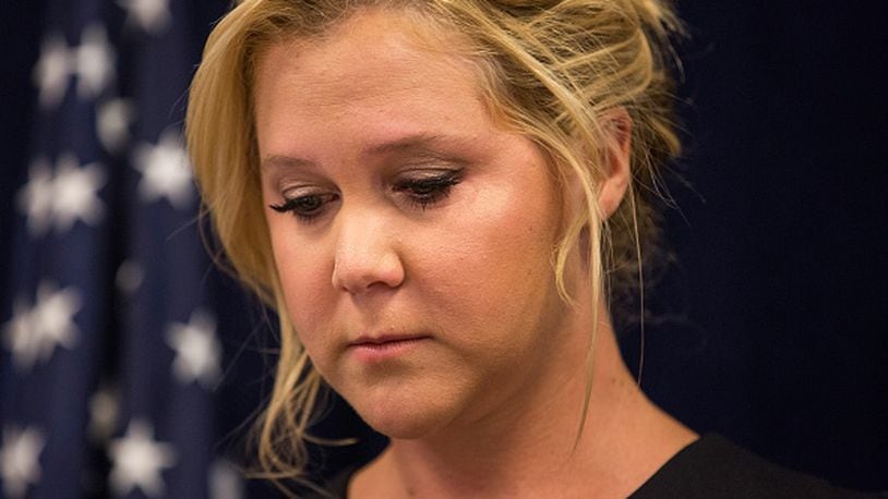 NEW YORK, NY - AUGUST 03:  Comedian Amy Schumer speaks at a press conference with U.S. Senator Chuck Schumer (D-NY) calling for tighter gun laws in an effort to stop mass shootings and gun violence on August 3, 2015 in New York City. A gunman killed two women last month in Louisiana during a showing of Schumer's movie "Trainwreck."  (Photo by Andrew Burton/Getty Images)