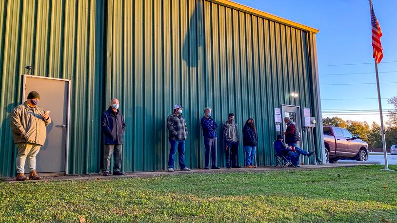 FILE - Voters wait for the polls to open to cast their ballots in the 2020 election at the Farmville Volunteer Fire Department, Nov. 3, 2020, in Auburn, Ala. Some 170 foundations, donors and advisors have signed on to a pledge started by the nonprofit Democracy Fund to make their grants earlier this Election Year. A small portion of the billions spent around the November election will go to nonprofits working to boost voter participation and usually, those funds come in right before Election Day. (AP Photo/Julie Bennett)