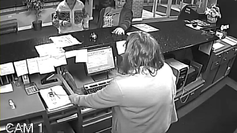 A security camera at the Fairborn Hotel shows one of the women who robbed a 95-year-old veteran Thursday night.