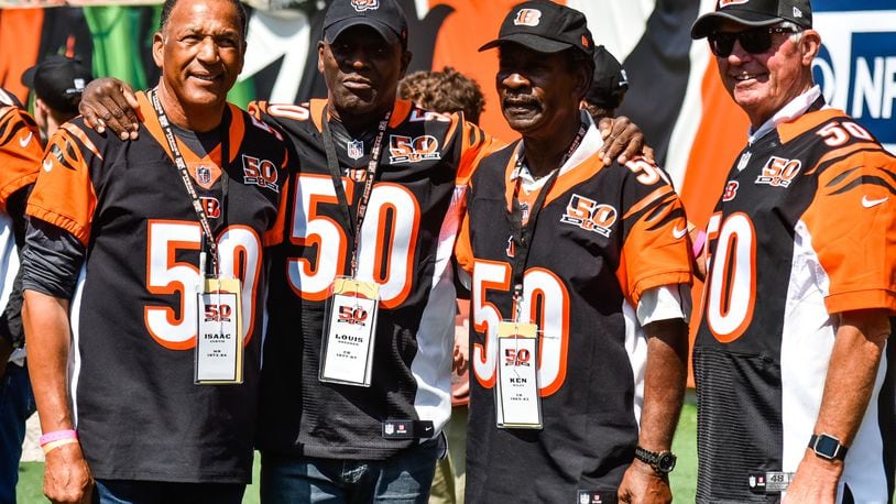 Former Bengals players (L to R) Isaac Curtis, Louis Breeden, Ken Riley and Ken Anderson gather before they are recognized at halftime. The Cincinnati Bengals lost 20-0 to the Baltimore Ravens Sunday, Sept. 10 at Paul Brown Stadium in Cincinnati. NICK GRAHAM/STAFF