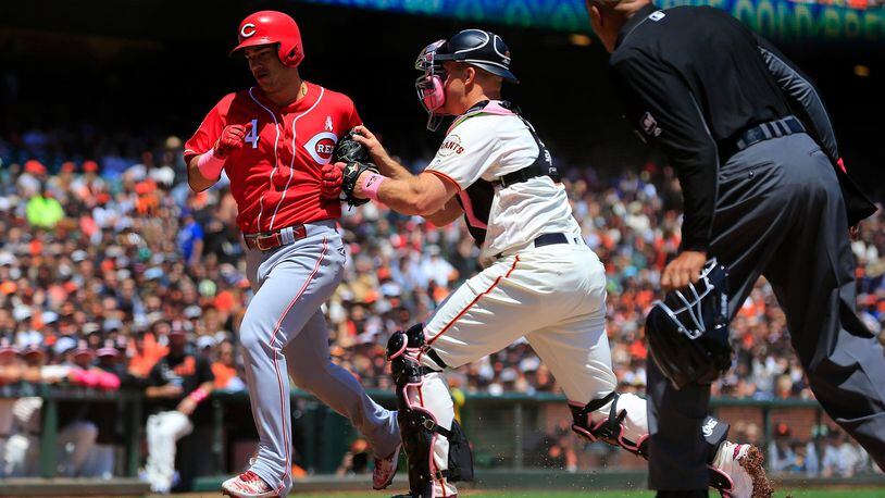 The Reds’ Jose Iglesias is tagged out at home by the Giants’ Erik Kratz during the first inning at Oracle Park on Sunday, May 12, 2019 in San Francisco, California. (Photo by Daniel Shirey/Getty Images)